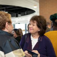 Lynn Blue greeting guests at the Lynn M. Blue Connection Naming Ceremony